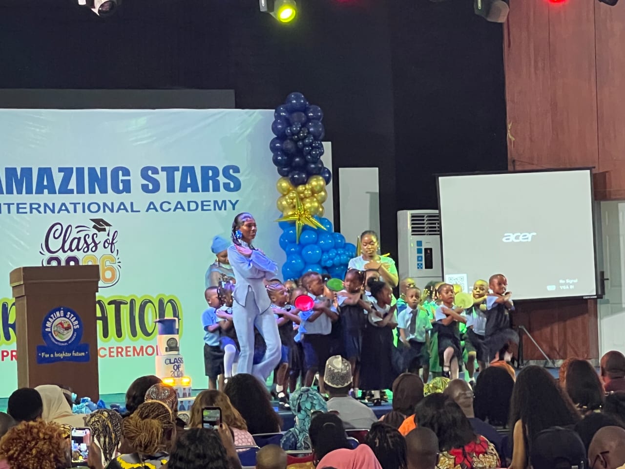 Pupils on stage during a Foundation school eye health programme at Amazing Stars International Academy
